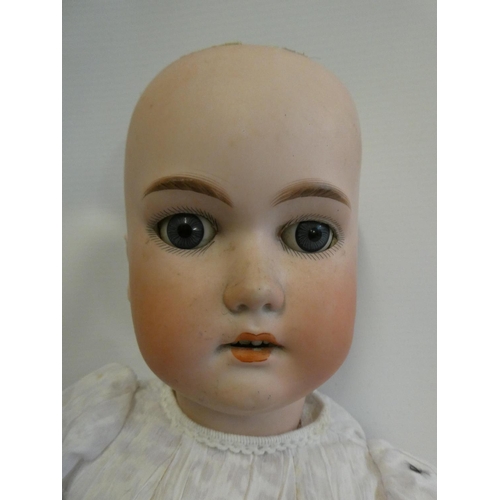 35 - A C. M. Bergmann bisque socket head doll, with blue glass sleeping eyes, open mouth, teeth, blond wi... 