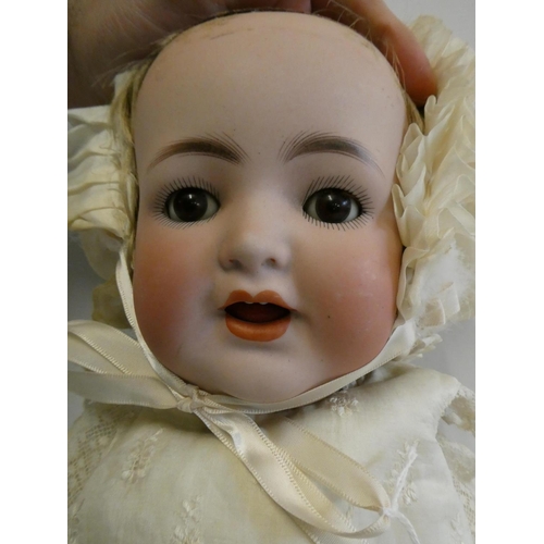 49 - A Kammer & Reinhardt bisque socket head character doll, with brown glass sleeping eyes, open mouth, ... 