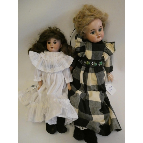 58 - Two Armand Marseille bisque shoulder head dolls, comprising one 3200 with brown glass fixed eyes, op... 