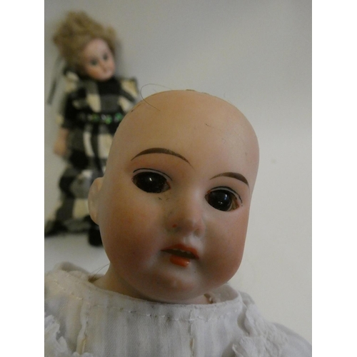 58 - Two Armand Marseille bisque shoulder head dolls, comprising one 3200 with brown glass fixed eyes, op... 