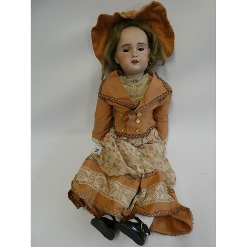 61 - An SFBJ bisque socket head doll, with brown glass sleeping eyes, open mouth, 6 top teeth, pierced ea... 