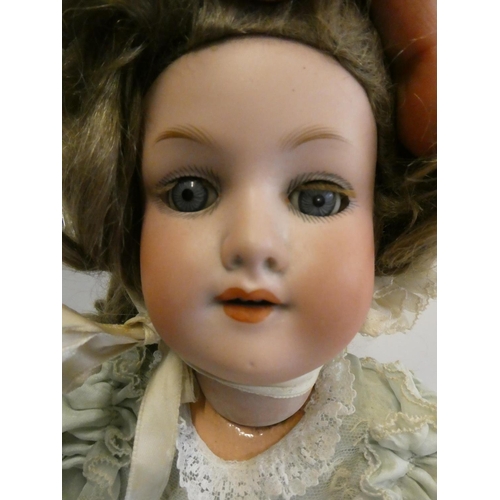 64 - An Armand Marseille bisque socket head doll, with blue glass sleeping eyes, open mouth, teeth, light... 