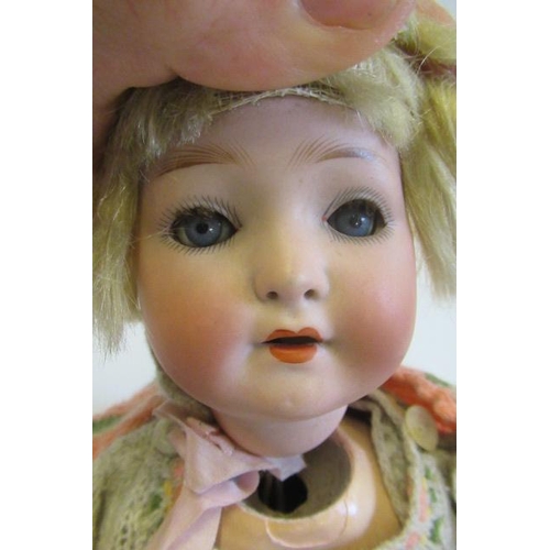 100A - A Heubach Koppelsdorf bisque shoulder head doll, with blue glass sleeping eyes, open mouth, composit... 