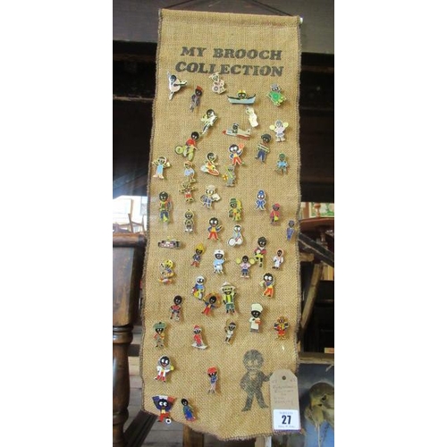 27 - ROBERTSONS BROOCHES ON WALL HANGING