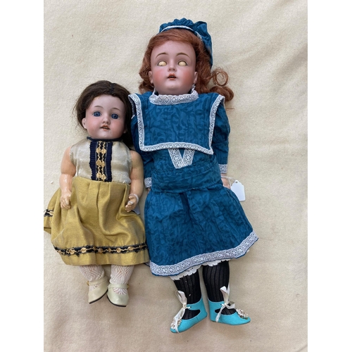 41 - Two bisque socket head dolls, comprising a 14