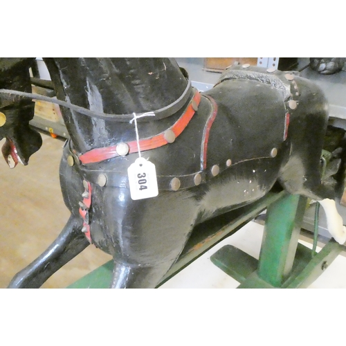 304 - An antique rocking horse 