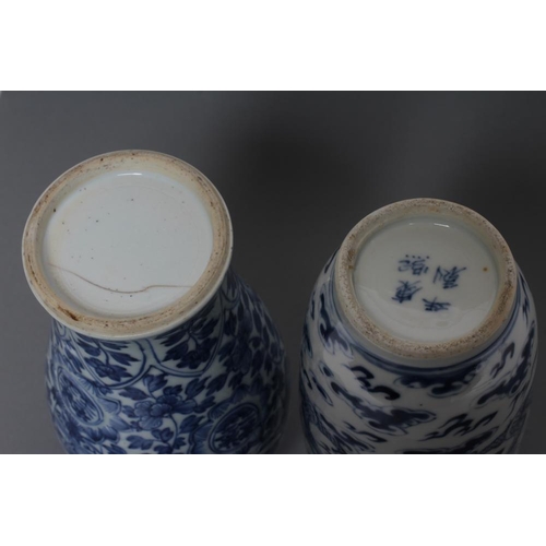 1 - A CHINESE PORCELAIN ROULEAU VASE painted in underglaze blue with two dragons chasing the flaming pea... 