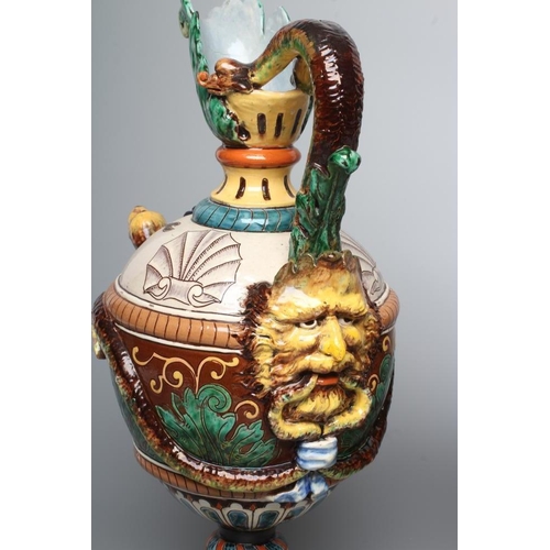 15 - A PAIR OF MAIOLICA PEDESTAL EWERS, c.1900, of ovoid form with acanthus lip, bi-furcated snake's head... 