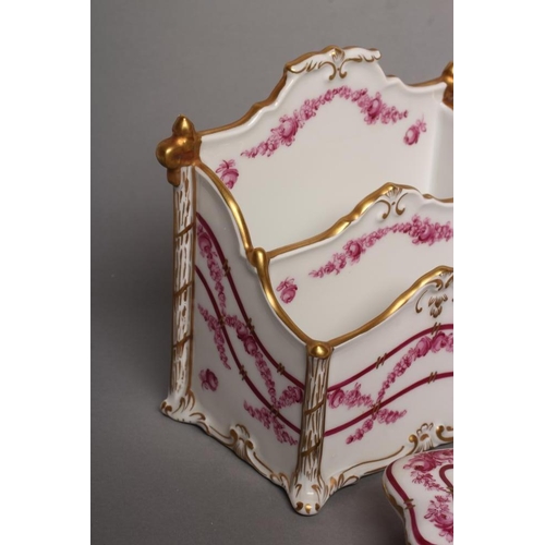 16 - A DRESDEN PORCELAIN LETTER RACK AND MATCHING ROCKER BLOTTER, 20th century, painted on-glaze en camie... 