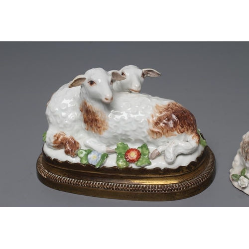 23 - A MEISSEN PORCELAIN GROUP, early 19th century, modelled as two recumbent sheep on a flower encrusted... 