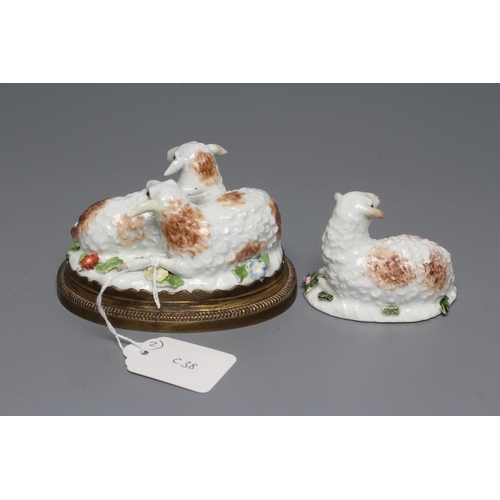 23 - A MEISSEN PORCELAIN GROUP, early 19th century, modelled as two recumbent sheep on a flower encrusted... 