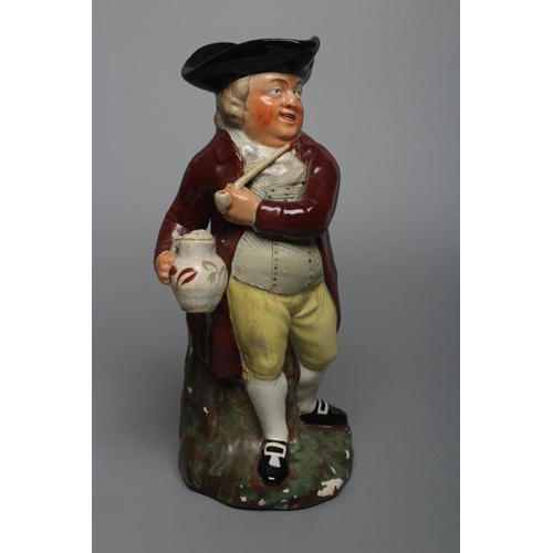 25 - A STAFFORDSHIRE POTTERY SQUIRE TOBY JUG, early 20th century, wearing a black tricorn hat, underglaze... 