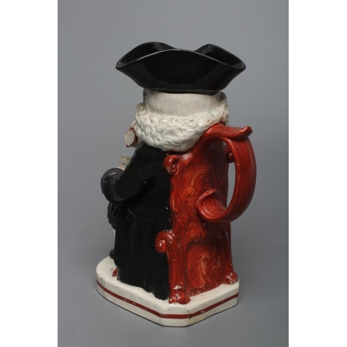 26 - AN ENOCH WOOD TYPE EARTHENWARE DRUNKEN PARSON OR DR. JOHNSON TOBY JUG, c.1800, wearing a black trico... 