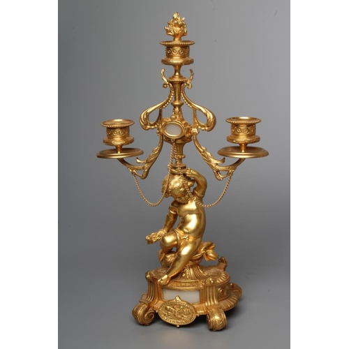 293 - A PAIR OF FRENCH GILT METAL THREE LIGHT FIGURAL CANDELABRA inset with onyx panels, early 20th centur... 