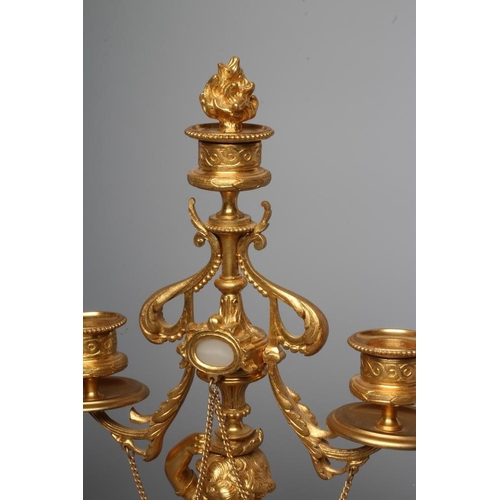 293 - A PAIR OF FRENCH GILT METAL THREE LIGHT FIGURAL CANDELABRA inset with onyx panels, early 20th centur... 