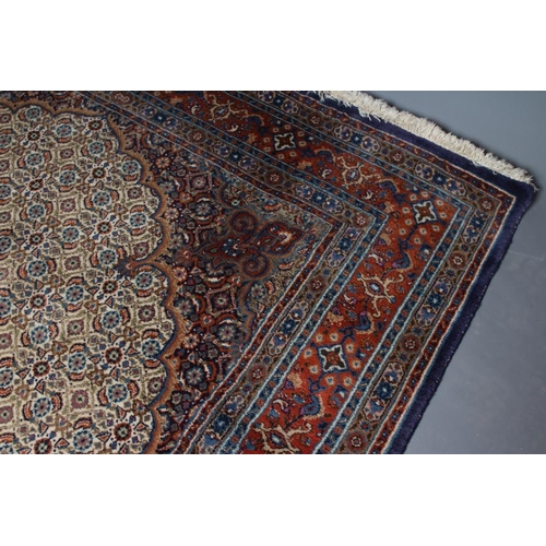 294 - A PERSIAN RUG, the ivory field with all over repeating flowerhead and leaf pattern in shades of blue... 