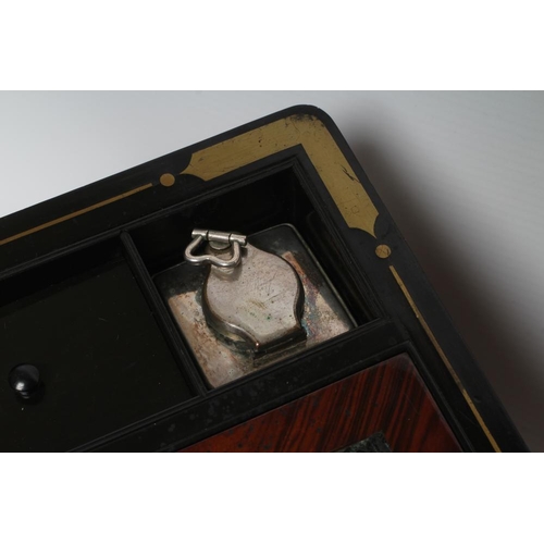 296 - A VICTORIAN MAHOGANY AND BRASS BOUND LAP DESK, the lid inset with brass shield inscribed 