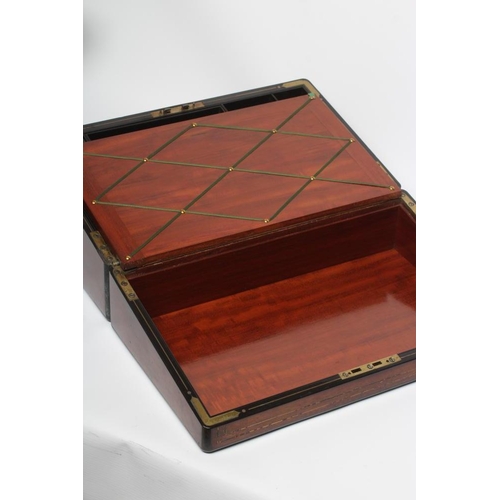 296 - A VICTORIAN MAHOGANY AND BRASS BOUND LAP DESK, the lid inset with brass shield inscribed 