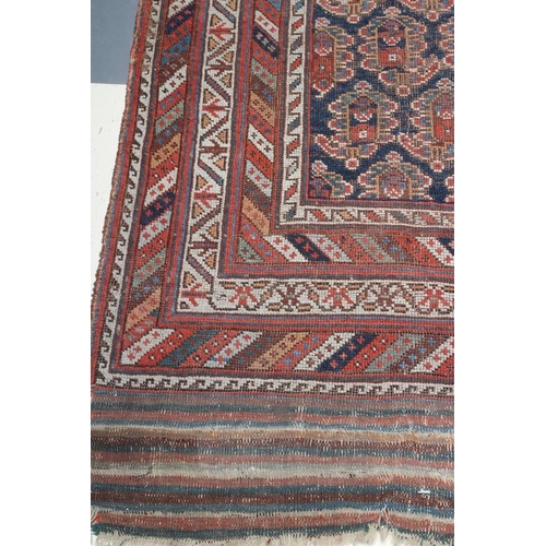 303 - A SHRIVAN BAKU RUG, South East Caucasus, late19/20th century, the indigo blue field with repeating b... 