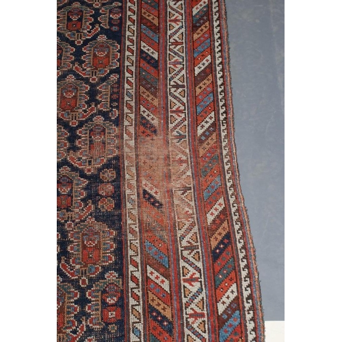 303 - A SHRIVAN BAKU RUG, South East Caucasus, late19/20th century, the indigo blue field with repeating b... 