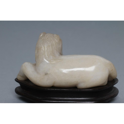 315 - TWO CHINESE JADEITE CARVINGS, one in greenish grey of a horse with a monkey on its back holding a ro... 