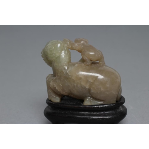 315 - TWO CHINESE JADEITE CARVINGS, one in greenish grey of a horse with a monkey on its back holding a ro... 