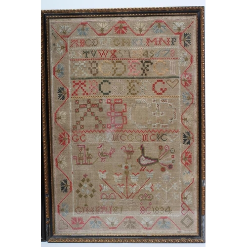 330 - A WILLIAM IV SAMPLER, 1834, worked in coloured wools in full cross stitch on a coarse linen ground w... 