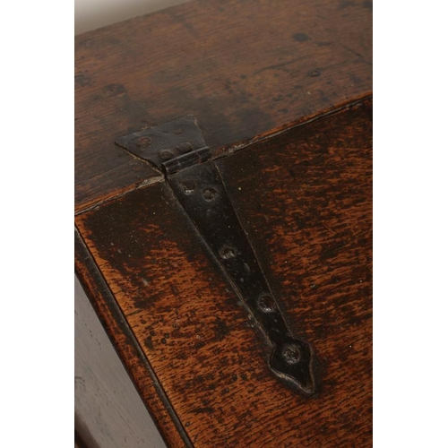 332 - A GEORGIAN OAK BOARDED BOX DESK, mid 18th century, the moulded edge slope with wrought iron strap hi... 