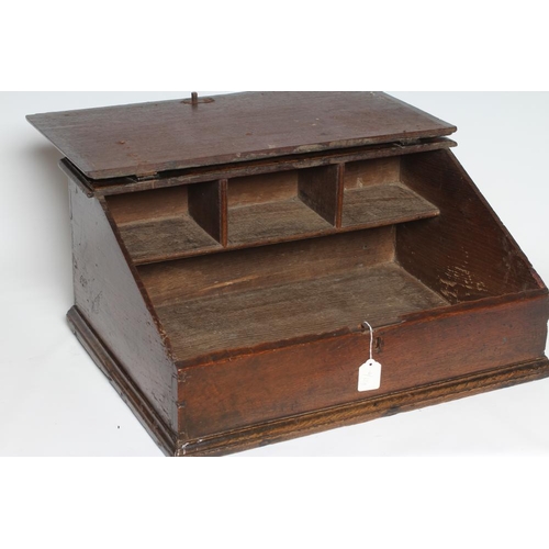 332 - A GEORGIAN OAK BOARDED BOX DESK, mid 18th century, the moulded edge slope with wrought iron strap hi... 