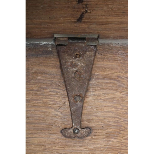 333 - A GEORGIAN OAK BOARDED BOX, mid 18th century, the moulded edge plank lid opening to a void interior,... 