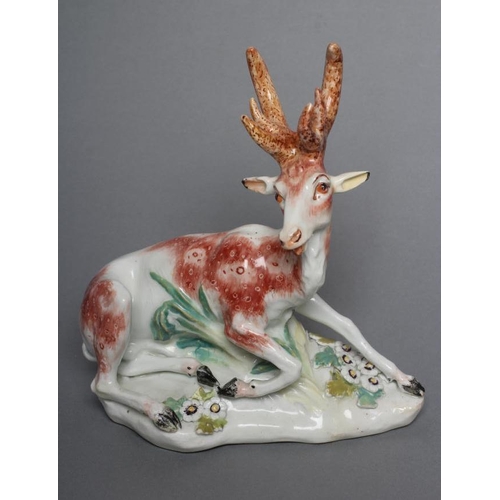 49 - A DERBY PORCELAIN STAG AND HIND, c.1760, each modelled recumbent on a flower encrusted shaped base, ... 