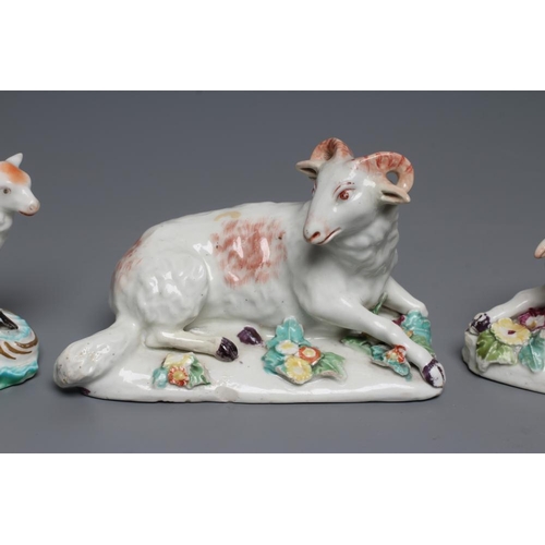 50 - A DERBY PORCELAIN RAM AND EWE, c.1760, each modelled recumbent on a flower encrusted shaped base, pa... 