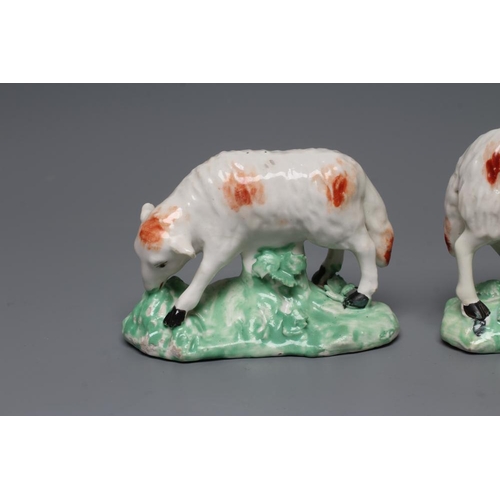 51 - A DERBY PORCELAIN GRAZING EWE, c.1760, standing on a flower enrusted shaped base, the fascia painted... 