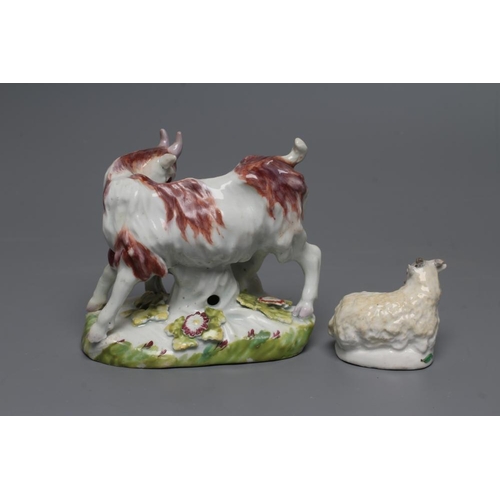 52 - A SMALL BOW PORCELAIN SHEEP, c.1755, modelled recumbent with pale yellow fleece, on a flower painted... 