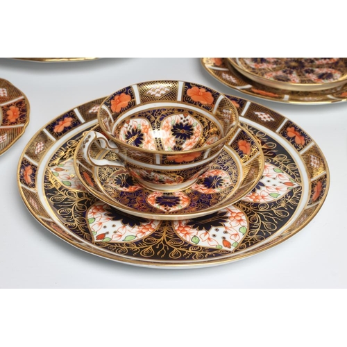 62 - TWO ROYAL CROWN DERBY CHINA IMARI PATTERN TRIOS, c.1920, together with another matching saucer and p... 