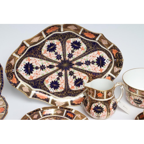 62 - TWO ROYAL CROWN DERBY CHINA IMARI PATTERN TRIOS, c.1920, together with another matching saucer and p... 