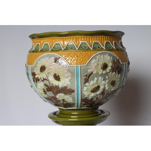 66 - A BURMANTOFTS FAIENCE JARDINIERE AND STAND, early 20th century, moulded and decorated in shades of y... 