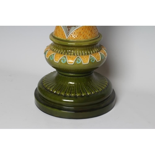 66 - A BURMANTOFTS FAIENCE JARDINIERE AND STAND, early 20th century, moulded and decorated in shades of y... 