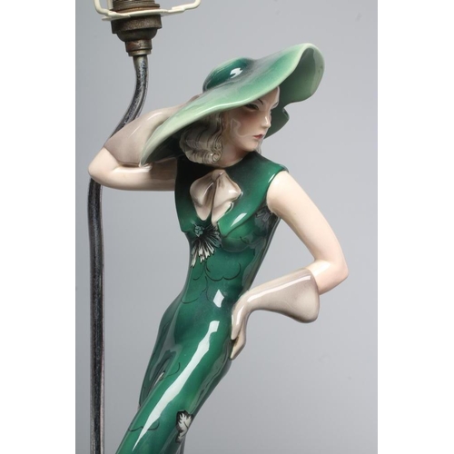 71 - AN ART DECO GOLDSCHEIDER EARTHENWARE FIGURE modelled as a young fashionable lady wearing a wide brim... 