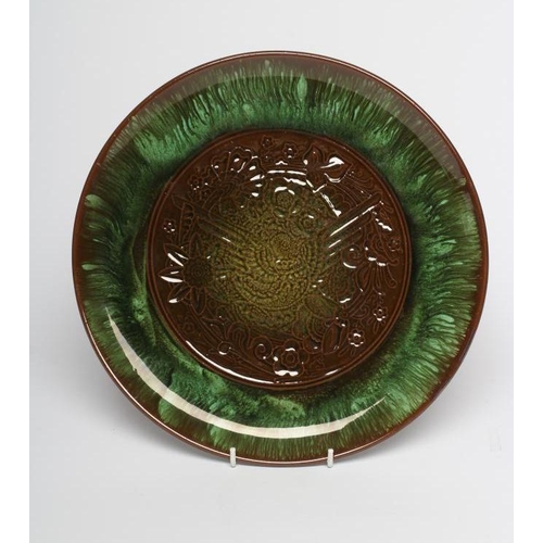 72 - A CHRISTOPHER DRESSER FOR AULT PLATTER, early 20th century, of plain circular form, the central roun... 