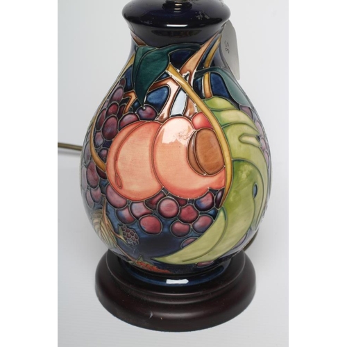 76 - A MOORCROFT POTTERY LAMP BASE, modern, of ovoid form, tubelined and painted in colours with the Quee... 