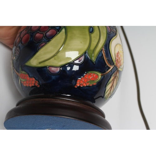 76 - A MOORCROFT POTTERY LAMP BASE, modern, of ovoid form, tubelined and painted in colours with the Quee... 