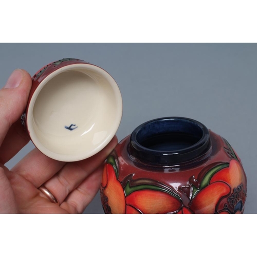 81 - A MOORCROFT POTTERY SMALL JAR AND COVER, 2017, of ovoid form, tubelined and painted in shades of red... 