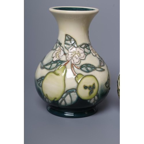 84 - A MOORCROFT POTTERY VASE, 1999, of baluster form, tubelined and painted in shades of green and white... 