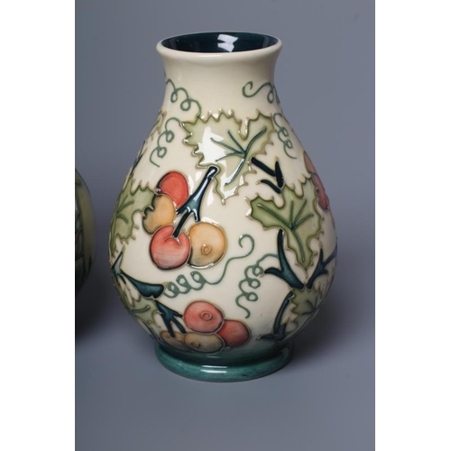 84 - A MOORCROFT POTTERY VASE, 1999, of baluster form, tubelined and painted in shades of green and white... 