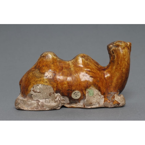 9 - A SMALL TANG STYLE RECUMBENT CAMEL, with museum style/collectors number K61/1706 inscribed in black,... 