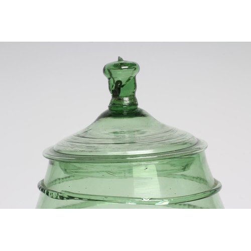 91 - A GERMAN GREEN DAUMENGLAS OR THUMB GLASS AND COVER, c.1800, of barrel form, the central section with... 