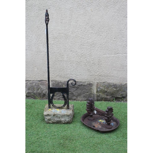 464 - A CAST IRON BOOT SCRAPER, c. 1900, on horse shoe support, the wrythen turned square hand rest with p... 