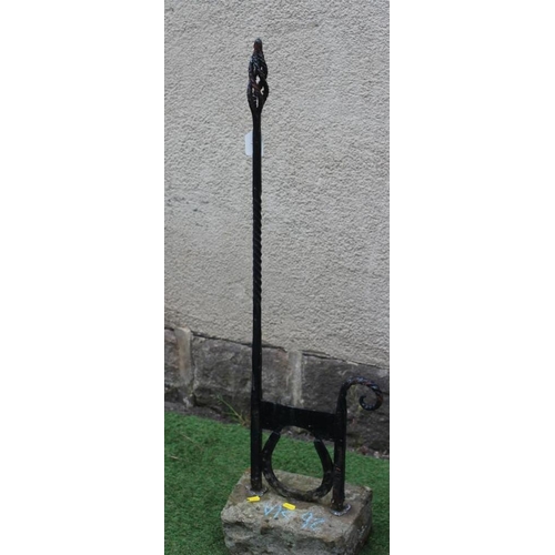 464 - A CAST IRON BOOT SCRAPER, c. 1900, on horse shoe support, the wrythen turned square hand rest with p... 