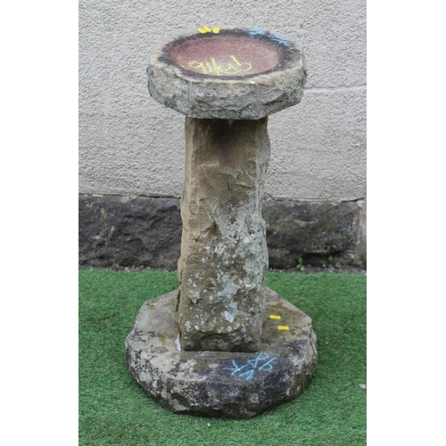 465 - A SANDSTONE BIRD BATH, the rough hewn octagonal bowl raised on square tapering stem and octagonal ba... 